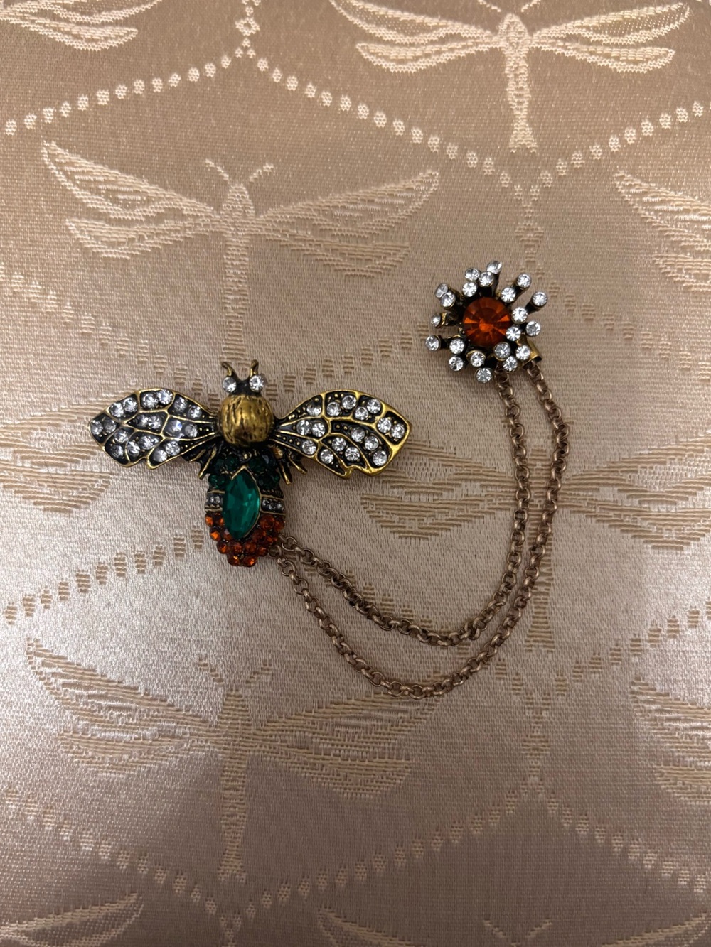 Aratta Firefly Brooch with Green, Yellow, Amber and Clear Crystals retails $40